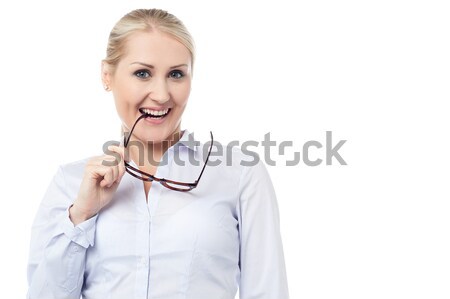 Mischievous smiling young corporate woman Stock photo © stockyimages