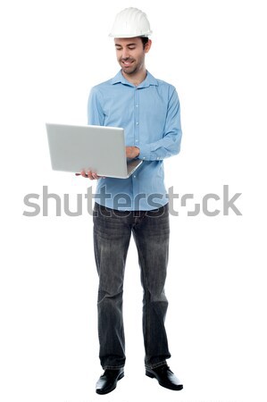 Budowniczy surfing laptop mężczyzna architekta usługi Zdjęcia stock © stockyimages
