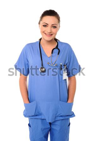 Atraente jovem médico sorridente feminino médico Foto stock © stockyimages