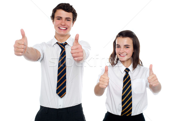 Students showing thumbs up to camera Stock photo © stockyimages
