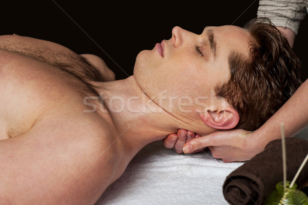 Stock photo: Smart guy getting spa treatment