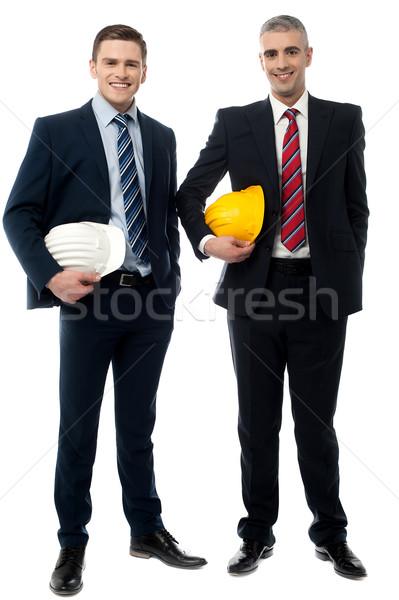 Two architects posing with safety helmet Stock photo © stockyimages