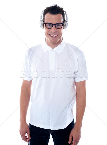 Casual guy enjoying music Stock photo © stockyimages