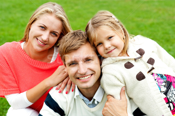 Joyous family of three. Loving and caring Stock photo © stockyimages