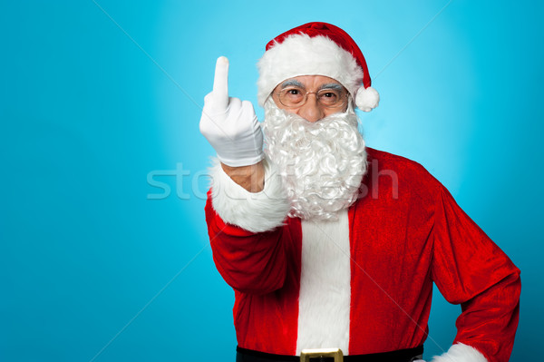 聖誕老人 顯示 中間 手指 相機 藍色 商業照片 © stockyimages
