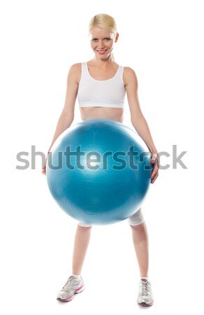 Young lady performing abdomen exercise Stock photo © stockyimages