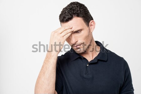 Worried man trying to remember something Stock photo © stockyimages
