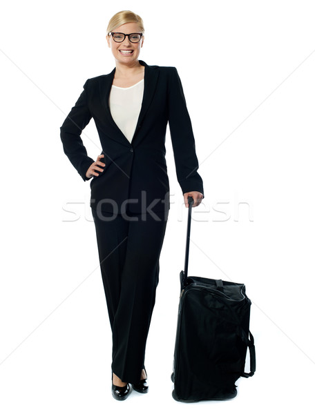 Corporate person carrying trolley bag Stock photo © stockyimages