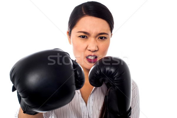 Female boxer with angry look on her face Stock photo © stockyimages