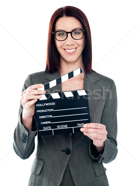 Business lady holding clapperboard Stock photo © stockyimages
