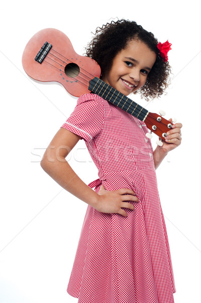 Atttactive school girl with toy guitar Stock photo © stockyimages