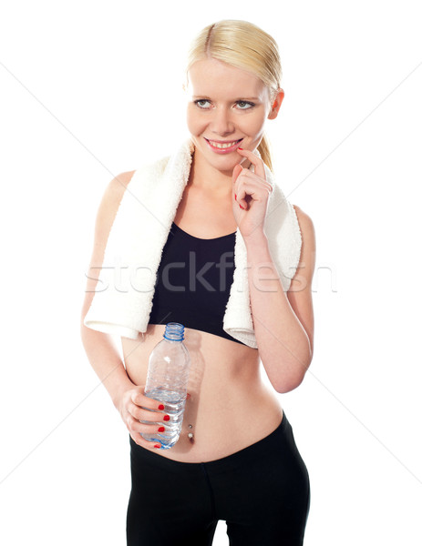 Portrait of smiling mischievous female Stock photo © stockyimages