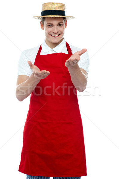 Handsome young male chef welcoming with smile Stock photo © stockyimages