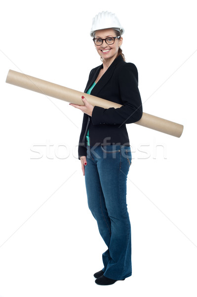 Experienced female architect holding site blueprints Stock photo © stockyimages