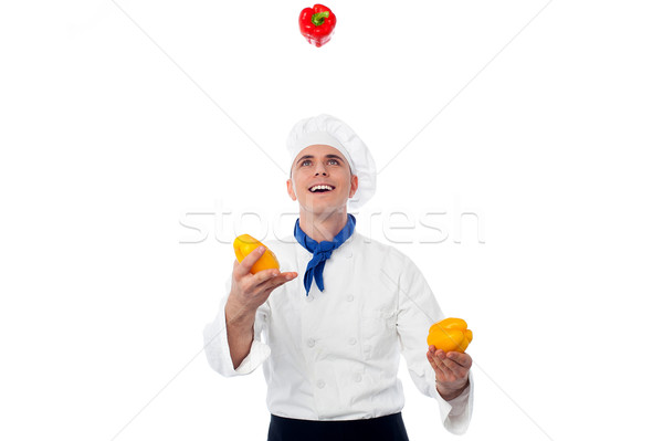 Chef juggling with vegetables Stock photo © stockyimages