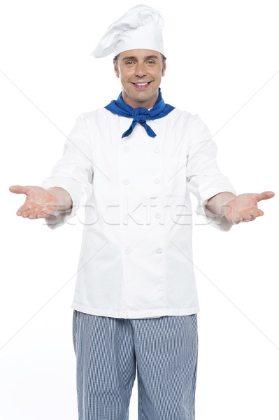 Souriant chef posant bras large ouvrir Photo stock © stockyimages