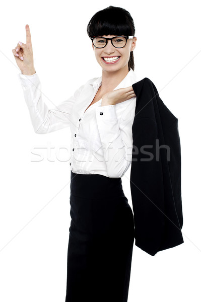 Animado femenino senalando sonrisa Foto stock © stockyimages