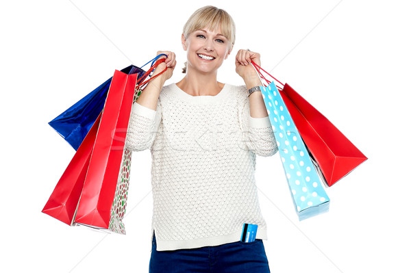Portrait of a middle aged shopaholic woman Stock photo © stockyimages