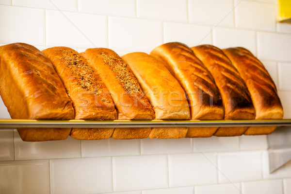 Freshly kneaded grain and white breads for sale Stock photo © stockyimages