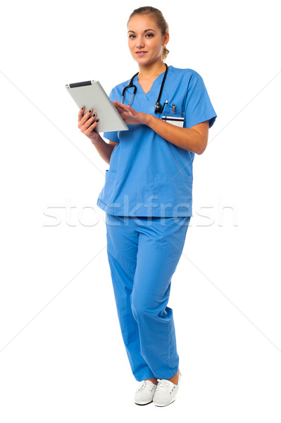Female doctor using tablet pc Stock photo © stockyimages