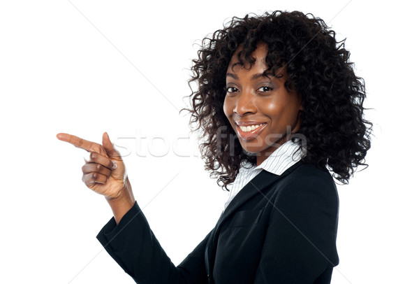 Corporate woman indicating towards copy space Stock photo © stockyimages