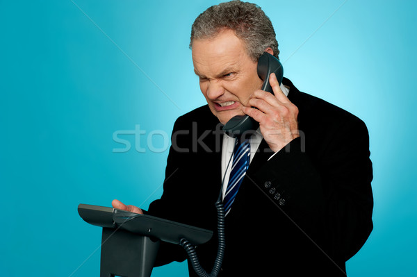 Irritato imprenditore comunicare telefono rabbia business Foto d'archivio © stockyimages