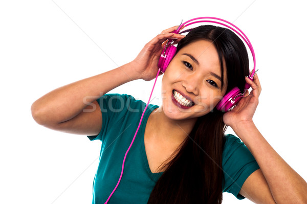 Adorable girl enjoying music Stock photo © stockyimages