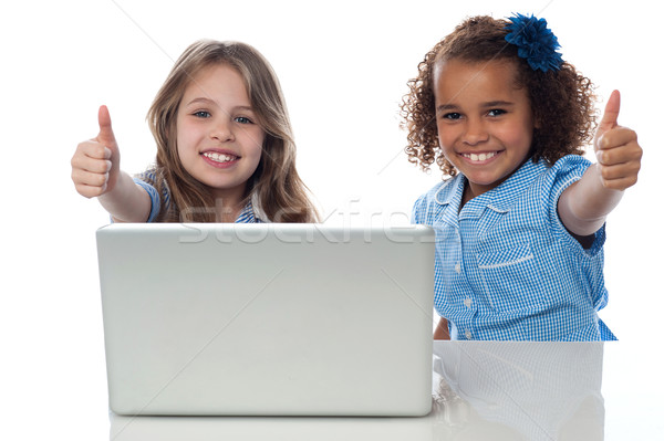 Two happy kids showing thumbs up Stock photo © stockyimages
