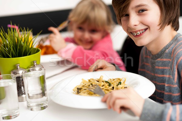Children enjoying their meals Stock photo © stockyimages