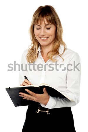 Stock photo: Female secretary writing notes