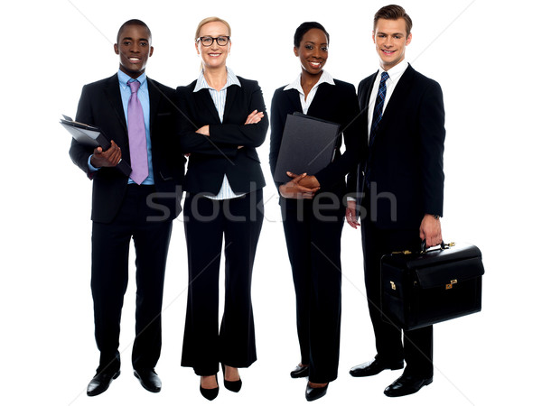 Fericit zâmbitor echipa de afaceri în picioare izolat Imagine de stoc © stockyimages
