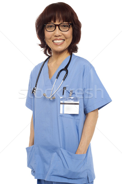 Relaxed female surgeon posing casually Stock photo © stockyimages