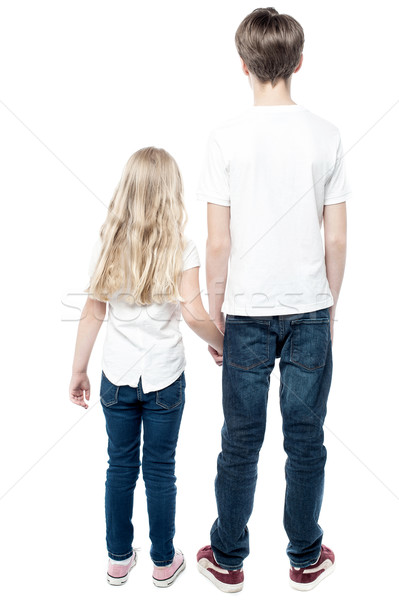 Rückansicht jungen Bruder halten Schwester Hand in Hand Stock foto © stockyimages