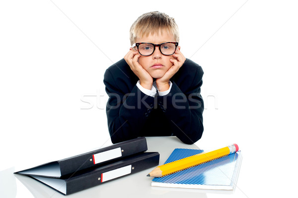Smutne patrząc chłopca ręce policzki posiedzenia Zdjęcia stock © stockyimages