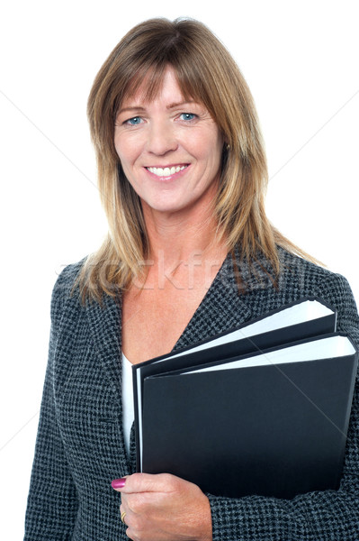 Corporate executive holding important documents Stock photo © stockyimages