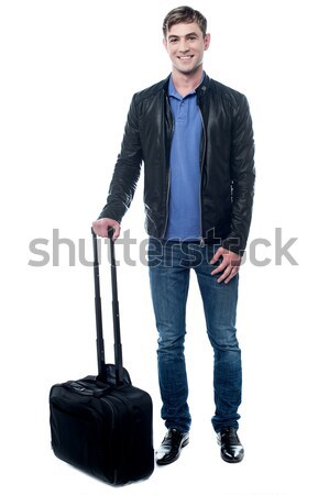 Smiling man standing with bag Stock photo © stockyimages