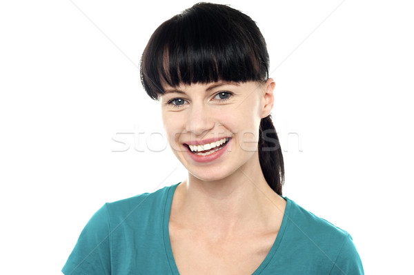 Charming young female flashing an impressive smile Stock photo © stockyimages