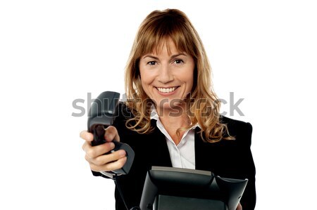 Sales executive displaying brand new multimedia phone Stock photo © stockyimages