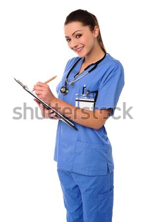 Attractive doctor holding x-ray report Stock photo © stockyimages