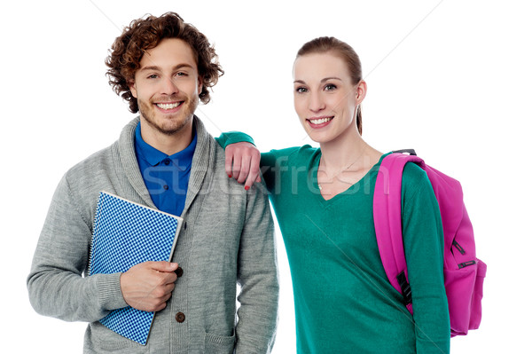 College girl resting her arm on friends shoulder Stock photo © stockyimages