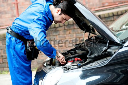 Mechanic repairing car's engine Stock photo © stockyimages