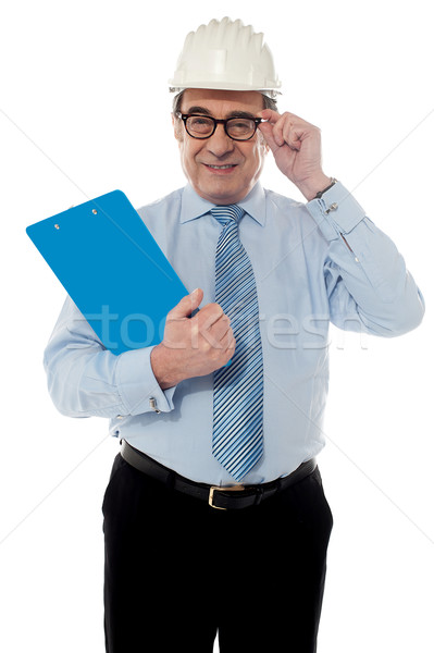 Smiling matured architect holding his eye-wear Stock photo © stockyimages