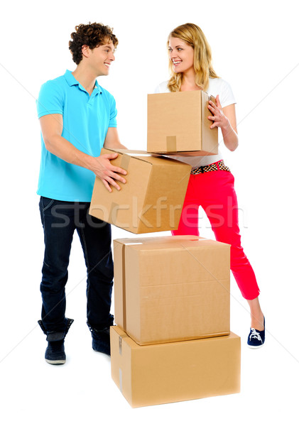 Couple carrying cardboard boxes Stock photo © stockyimages