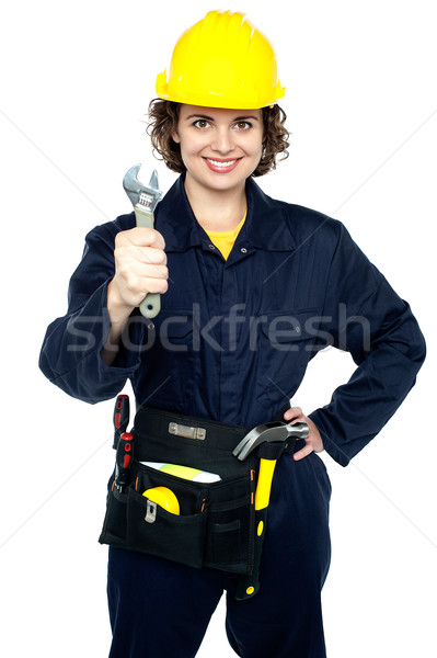 Active team woker holding spanner in hand Stock photo © stockyimages
