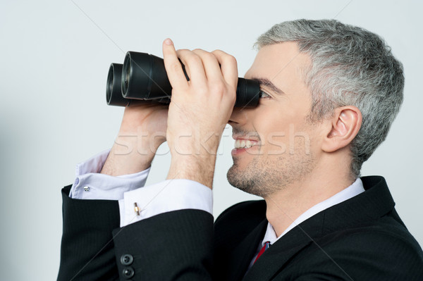 Stock photo: Young business man with binocular