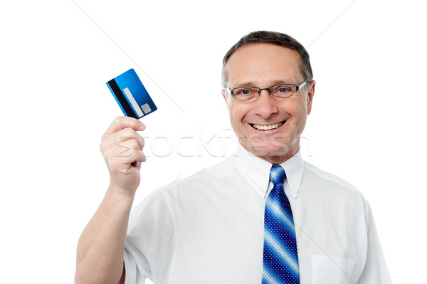 Successful businessman holding a credit card Stock photo © stockyimages