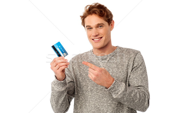 Guy pointing at his credit card Stock photo © stockyimages