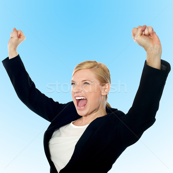 Corporate lady expressing success loudly Stock photo © stockyimages