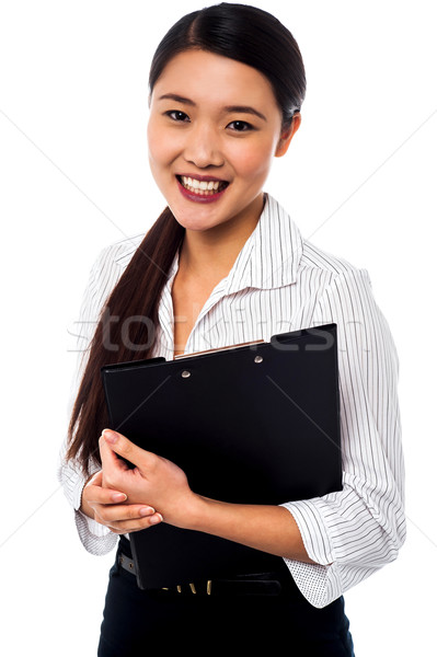 Pretty female executive posing Stock photo © stockyimages