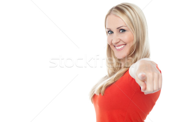 Lovely casual woman pointing towards camera Stock photo © stockyimages